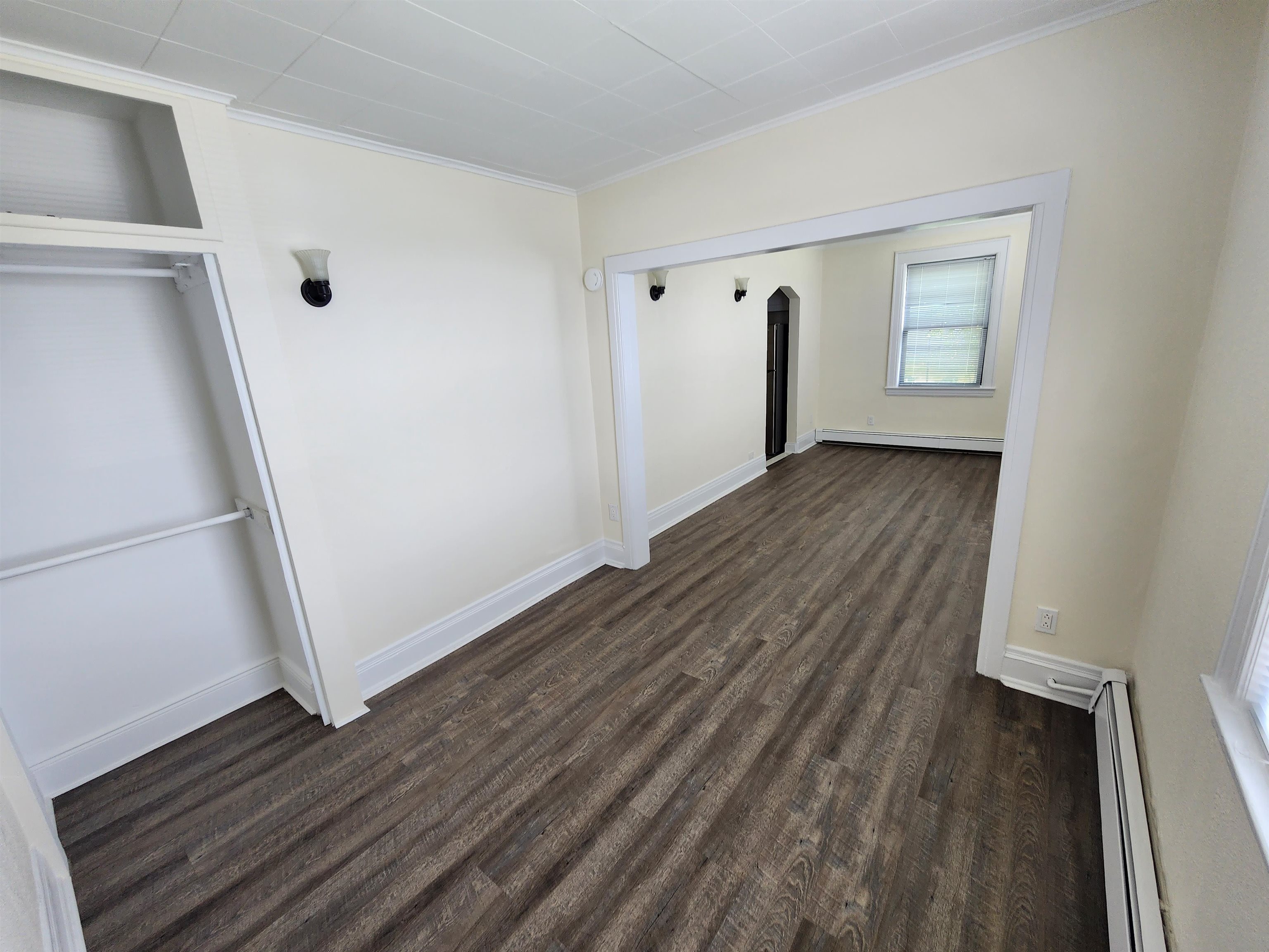 432 Broad Avenue, Unit 2 REAR Ridgefield, NJ 07657 - Photo 2 of 7 a view of an empty room with wooden floor and a window