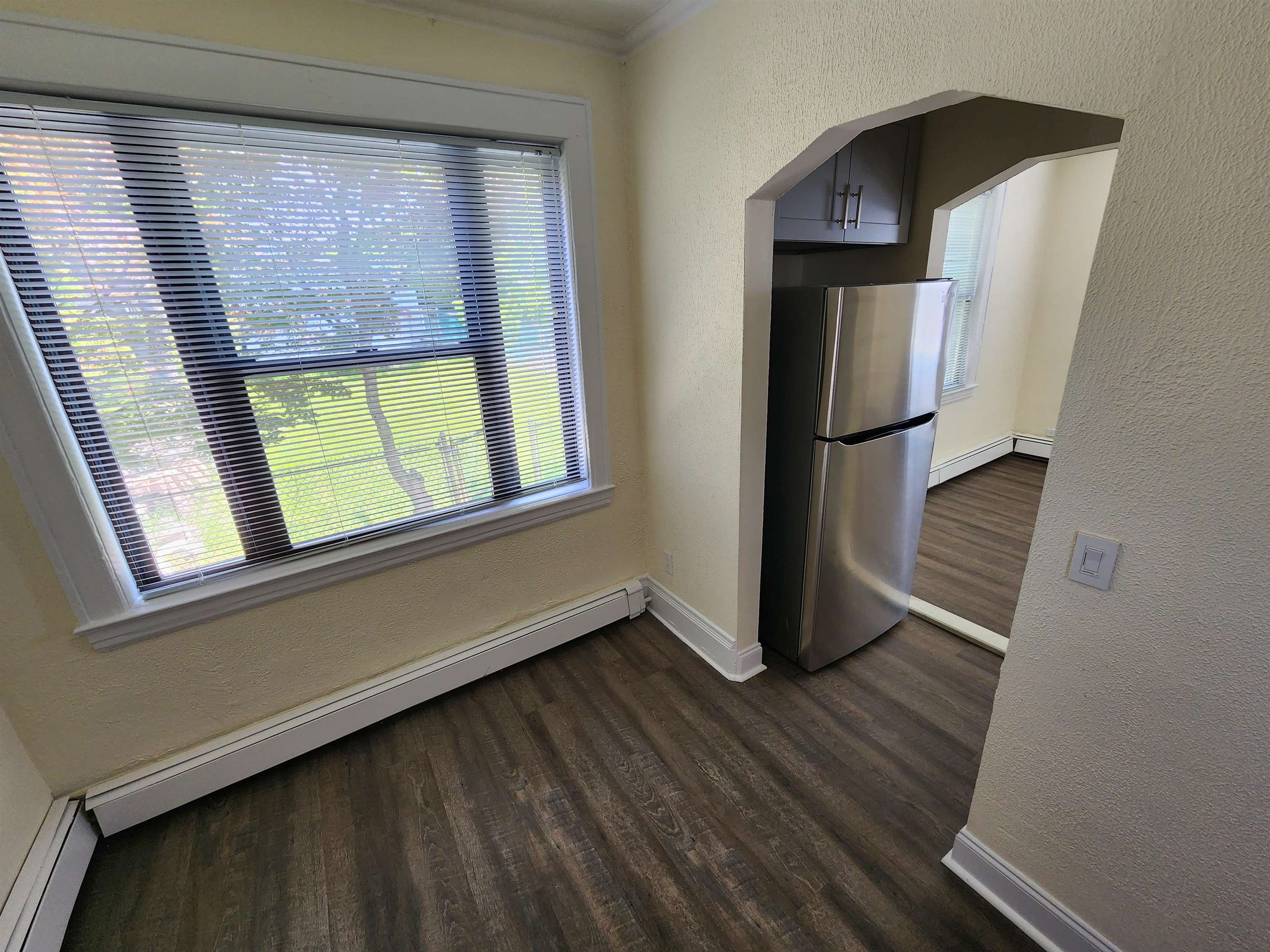 432 Broad Avenue, Unit 2 REAR Ridgefield, NJ 07657 - Photo 3 of 7 a view of empty room with wooden floor and fan