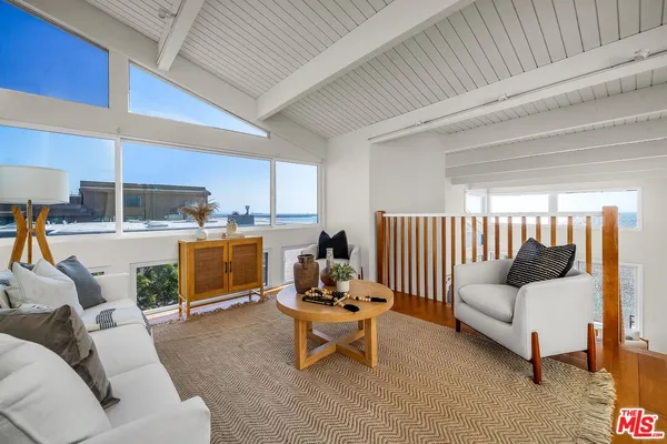 a bedroom with a large bed and a couch