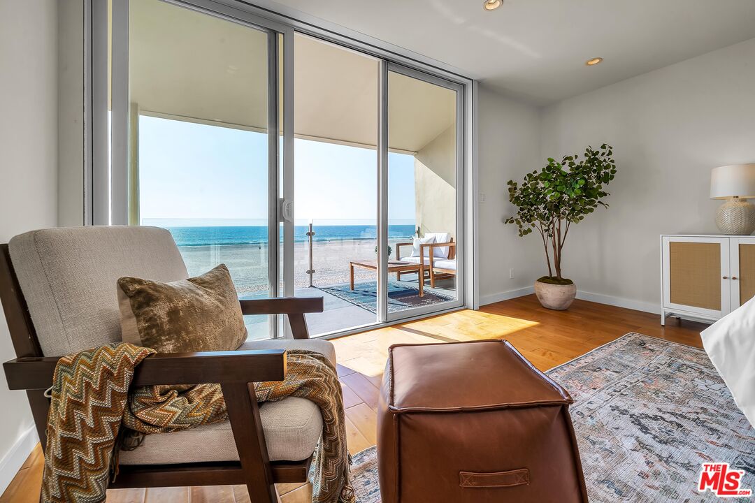 4 Lighthouse Street, Unit 13 Marina del Rey, CA 90292 - Photo 18 of 35 a living room with furniture and a floor to ceiling window