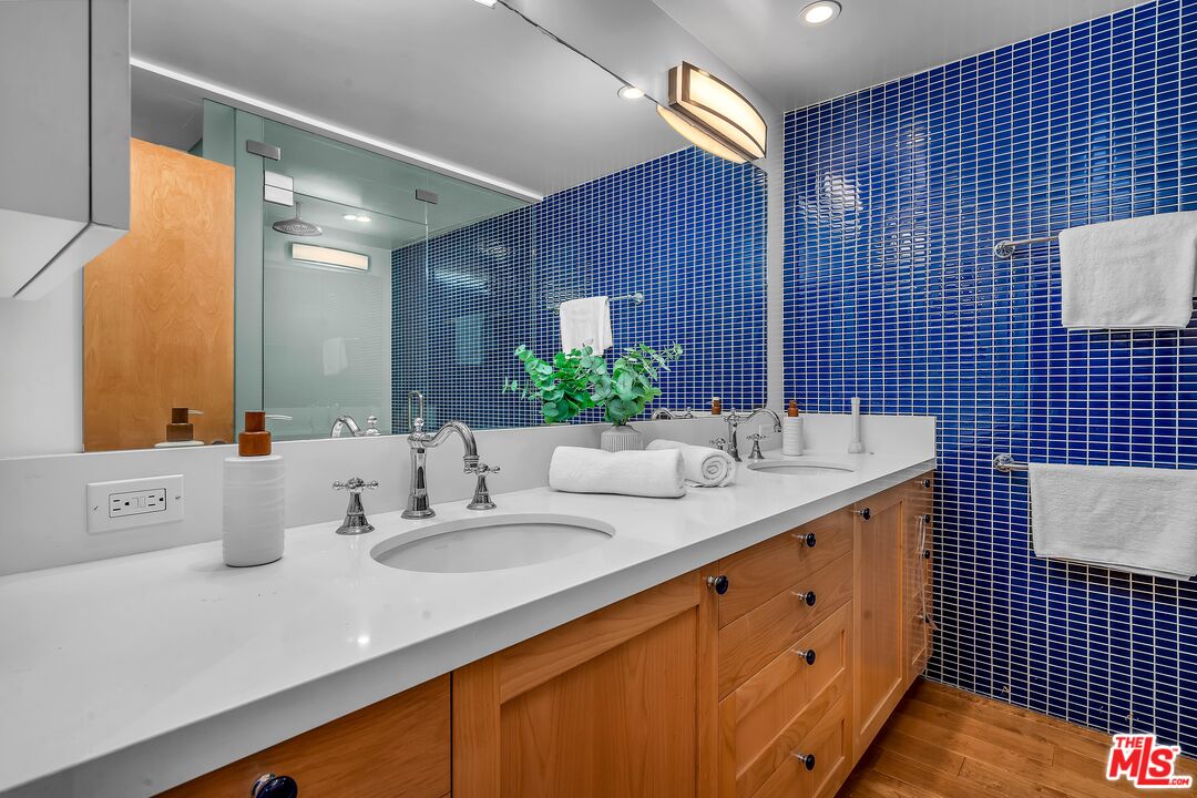 4 Lighthouse Street, Unit 13 Marina del Rey, CA 90292 - Photo 22 of 35 a bathroom with a double vanity sink and a mirror
