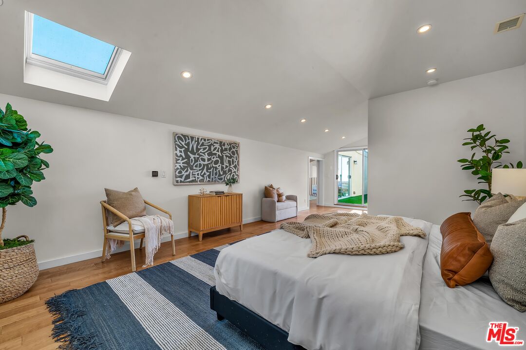 4 Lighthouse Street, Unit 13 Marina del Rey, CA 90292 - Photo 25 of 35 a spacious bedroom with a bed and a couch