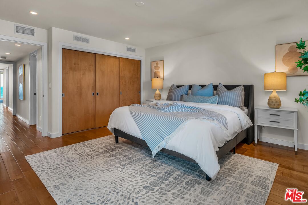 4 Lighthouse Street, Unit 13 Marina del Rey, CA 90292 - Photo 28 of 35 a bedroom with a bed and wooden floor