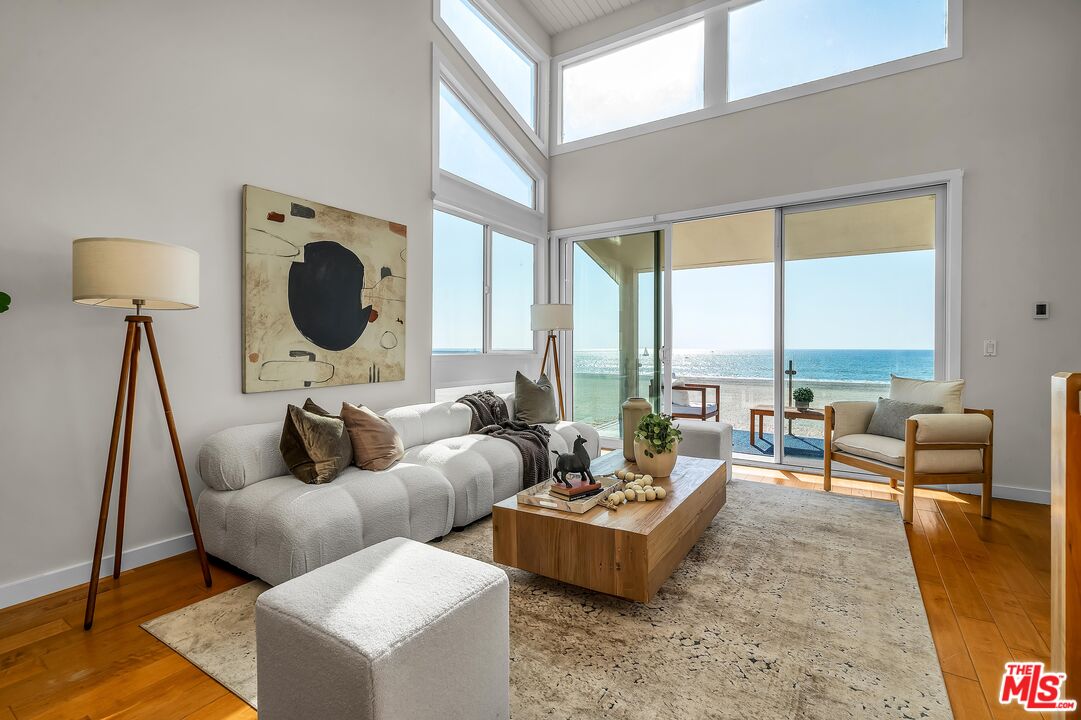4 Lighthouse Street, Unit 13 Marina del Rey, CA 90292 - Photo 4 of 35 a living room with furniture and a large window