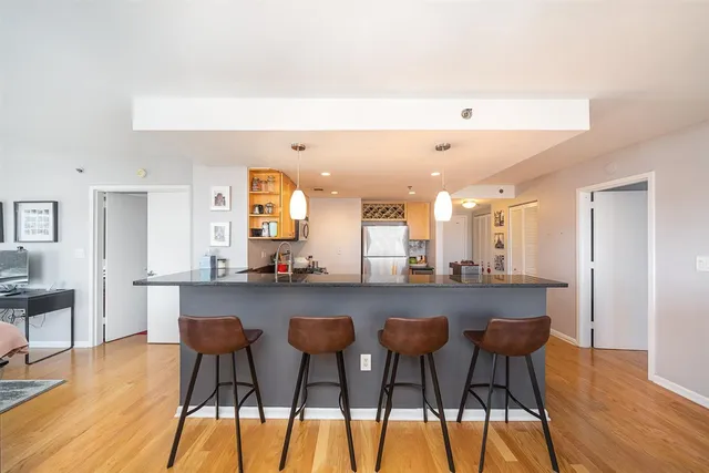 a large kitchen with a table and chairs in it