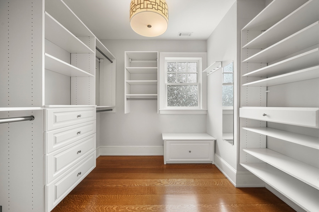 21 Cushing Road Wellesley, MA 02481 - Photo 13 of 31 a view of walk in closet with empty racks