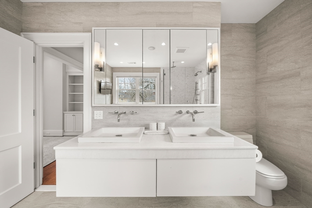 21 Cushing Road Wellesley, MA 02481 - Photo 15 of 31 a bathroom with a sink toilet and shower