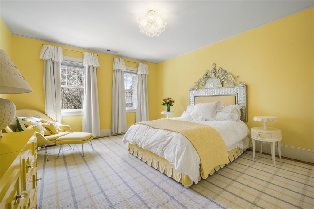 21 Cushing Road Wellesley, MA 02481 - Photo 16 of 31 a bedroom with a bed and wooden floor