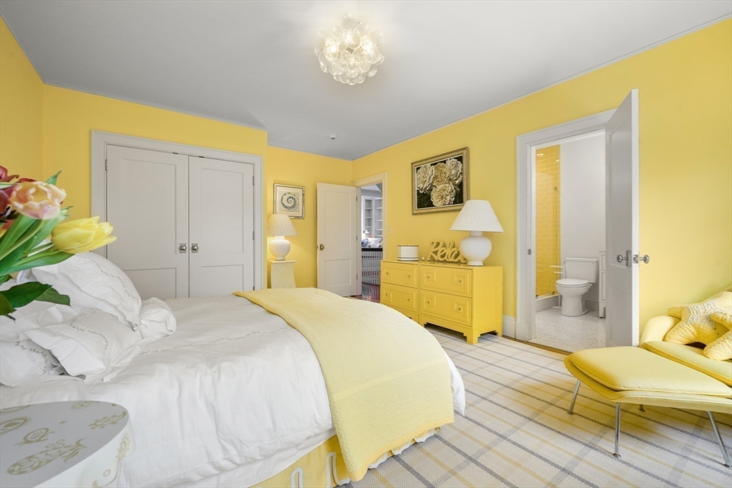 21 Cushing Road Wellesley, MA 02481 - Photo 17 of 31 a spacious bedroom with a bed and a couch