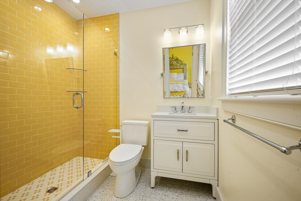 21 Cushing Road Wellesley, MA 02481 - Photo 18 of 31 a bathroom with a sink a toilet and shower