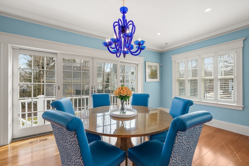 21 Cushing Road Wellesley, MA 02481 - Photo 4 of 31 a view of a dining room with furniture a chandelier and wooden floor