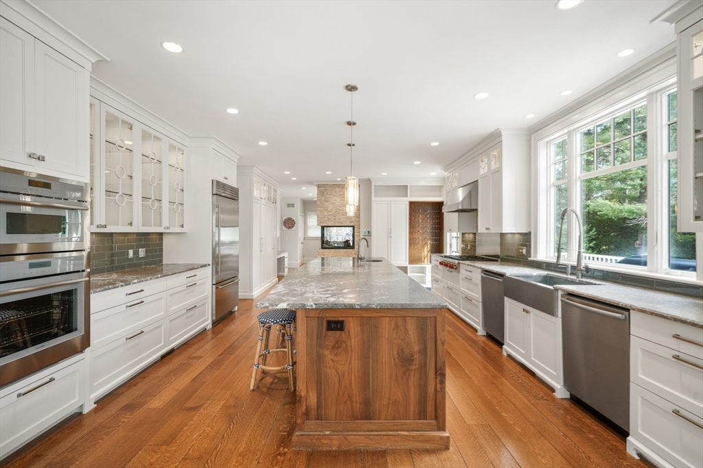 21 Cushing Road Wellesley, MA 02481 - Photo 5 of 31 a large kitchen with granite countertop lots of counter space and window