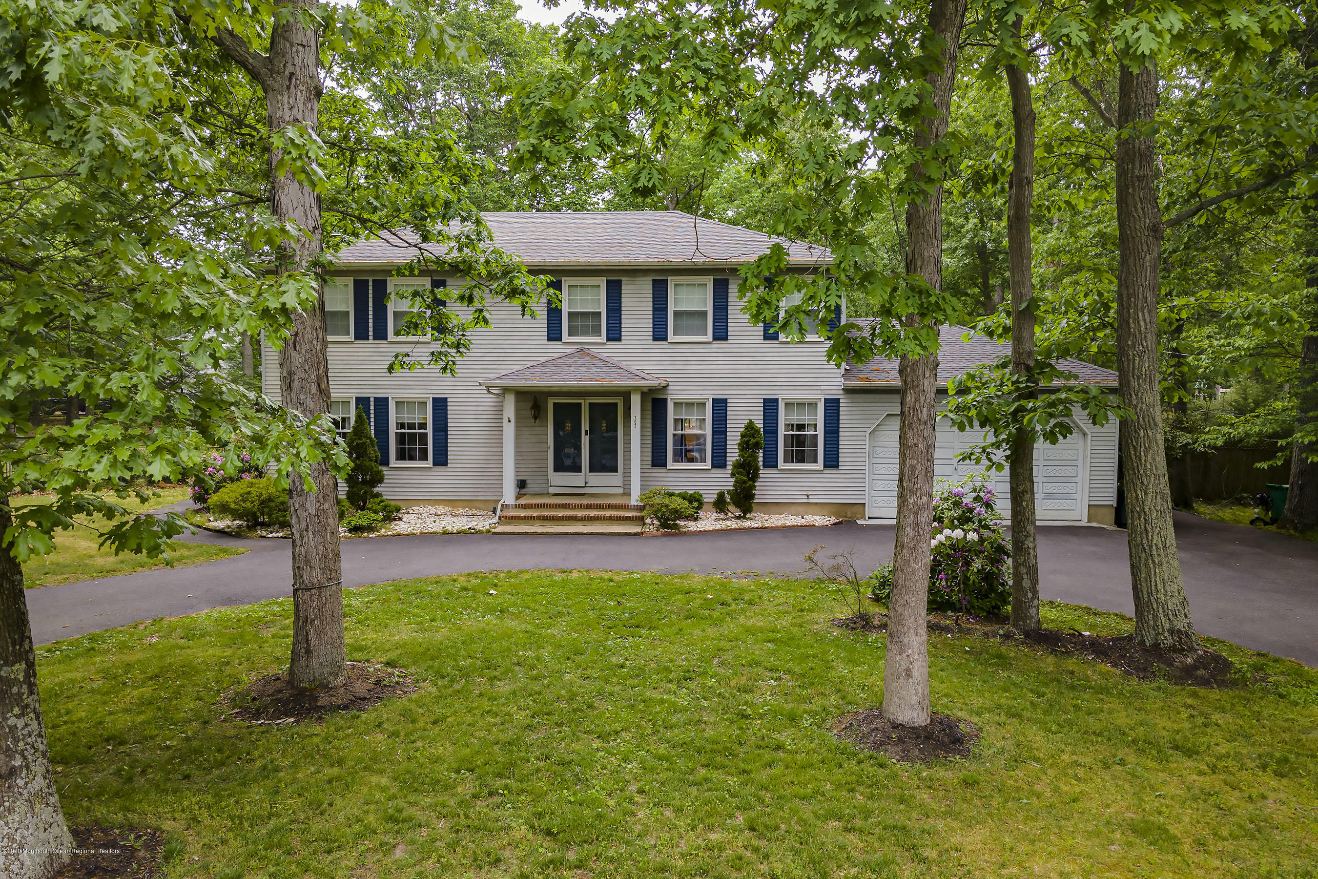 702 Green Valley Road Jackson, NJ 08527 - Photo 1 of 37 a front view of a house with yard and green space