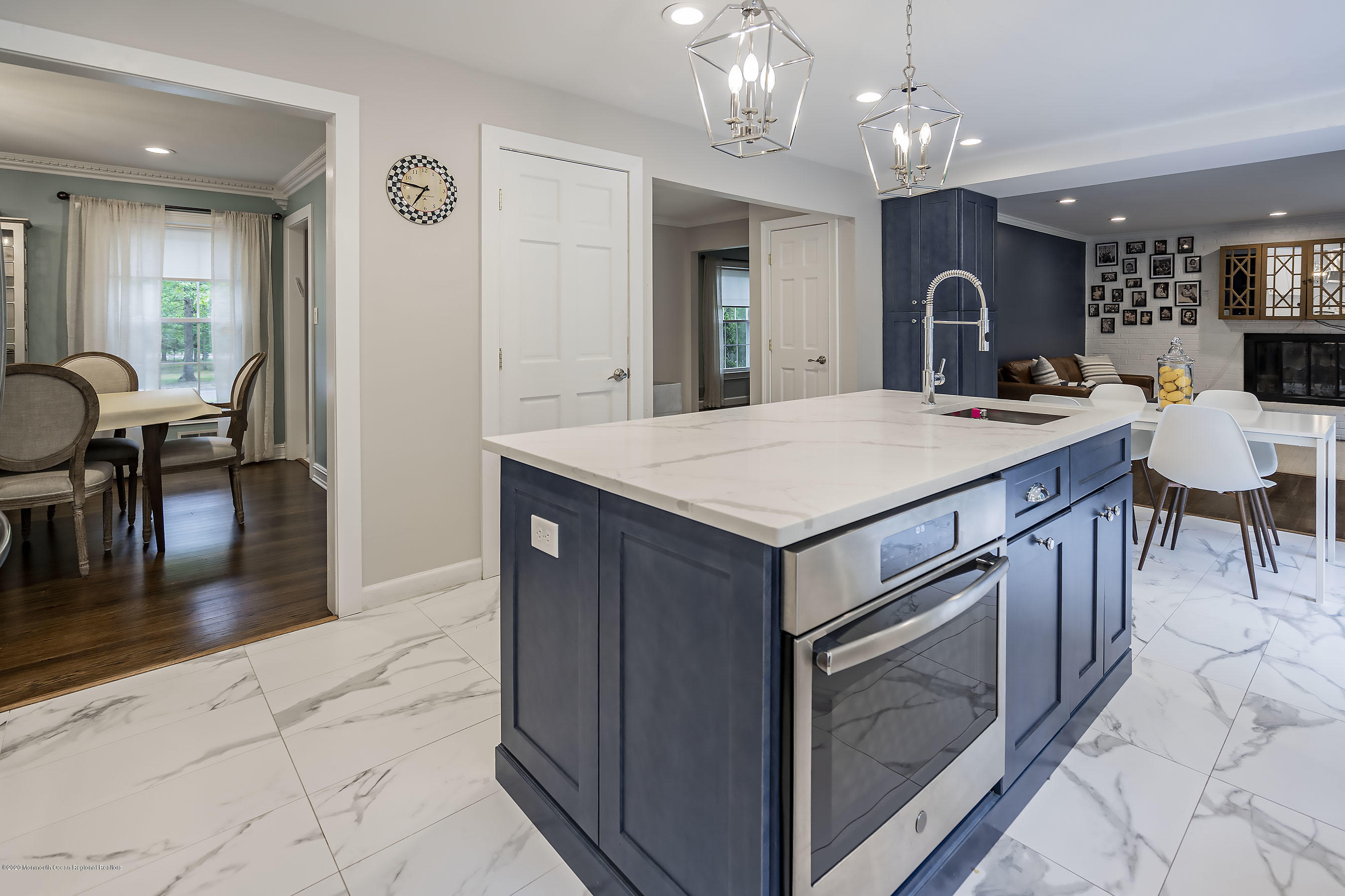 702 Green Valley Road Jackson, NJ 08527 - Photo 13 of 37 a kitchen with a stove a table and chairs in it