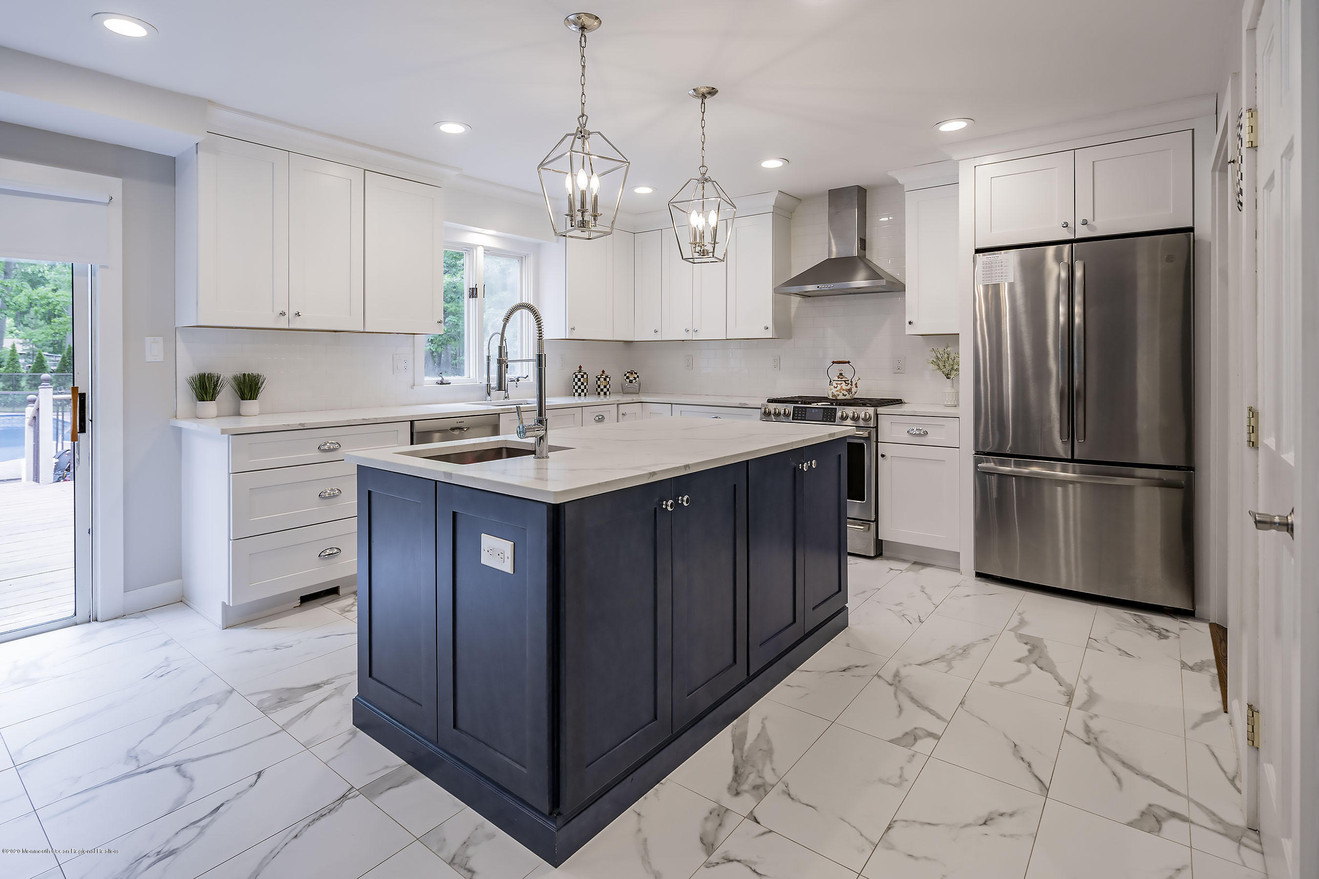 702 Green Valley Road Jackson, NJ 08527 - Photo 17 of 37 a kitchen with kitchen island granite countertop stainless steel appliances a sink a refrigerator a stove a microwave and cabinets