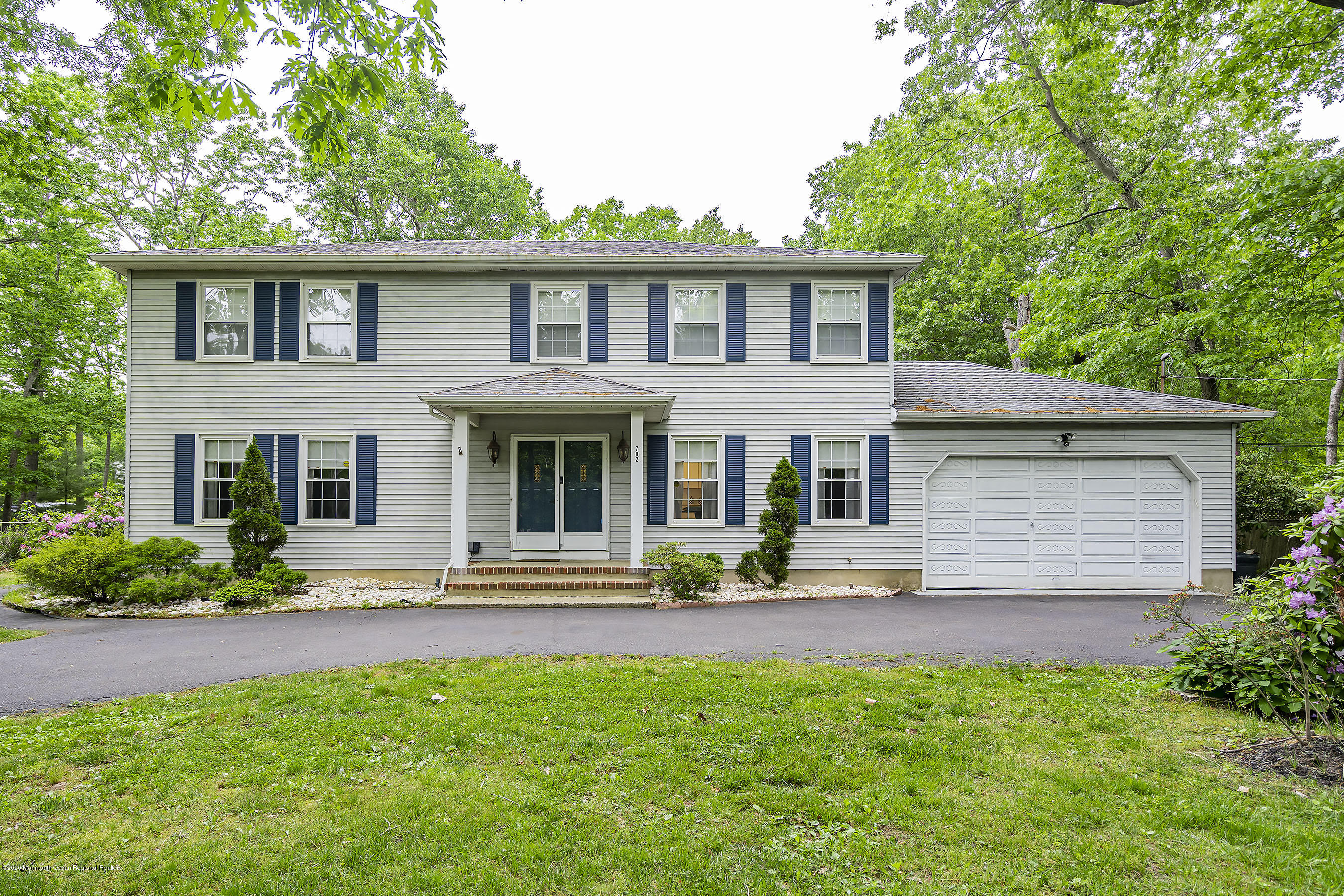 702 Green Valley Road Jackson, NJ 08527 - Photo 2 of 37 a front view of a house with a yard