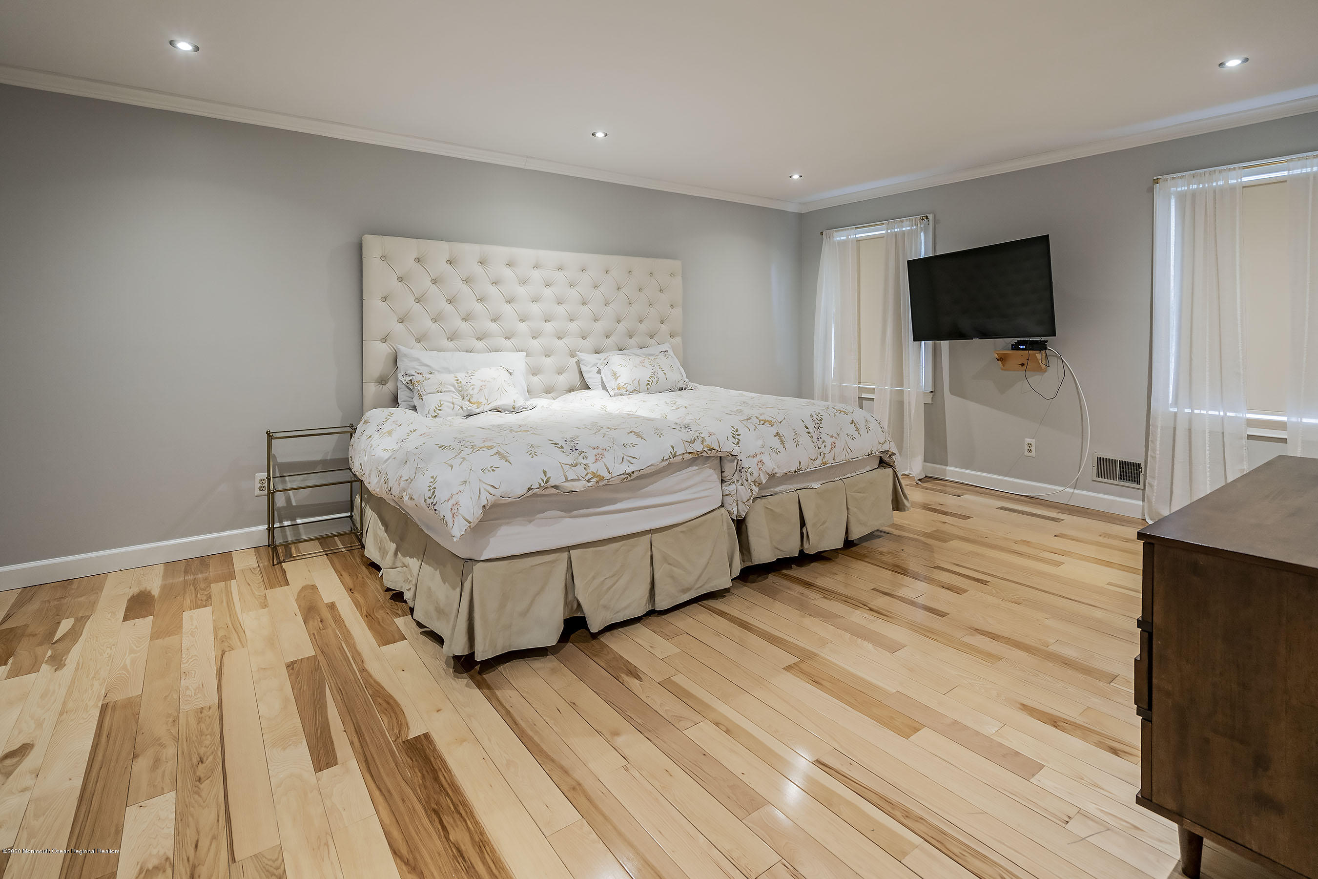 702 Green Valley Road Jackson, NJ 08527 - Photo 25 of 37 a spacious bedroom with a bed and a flat screen tv
