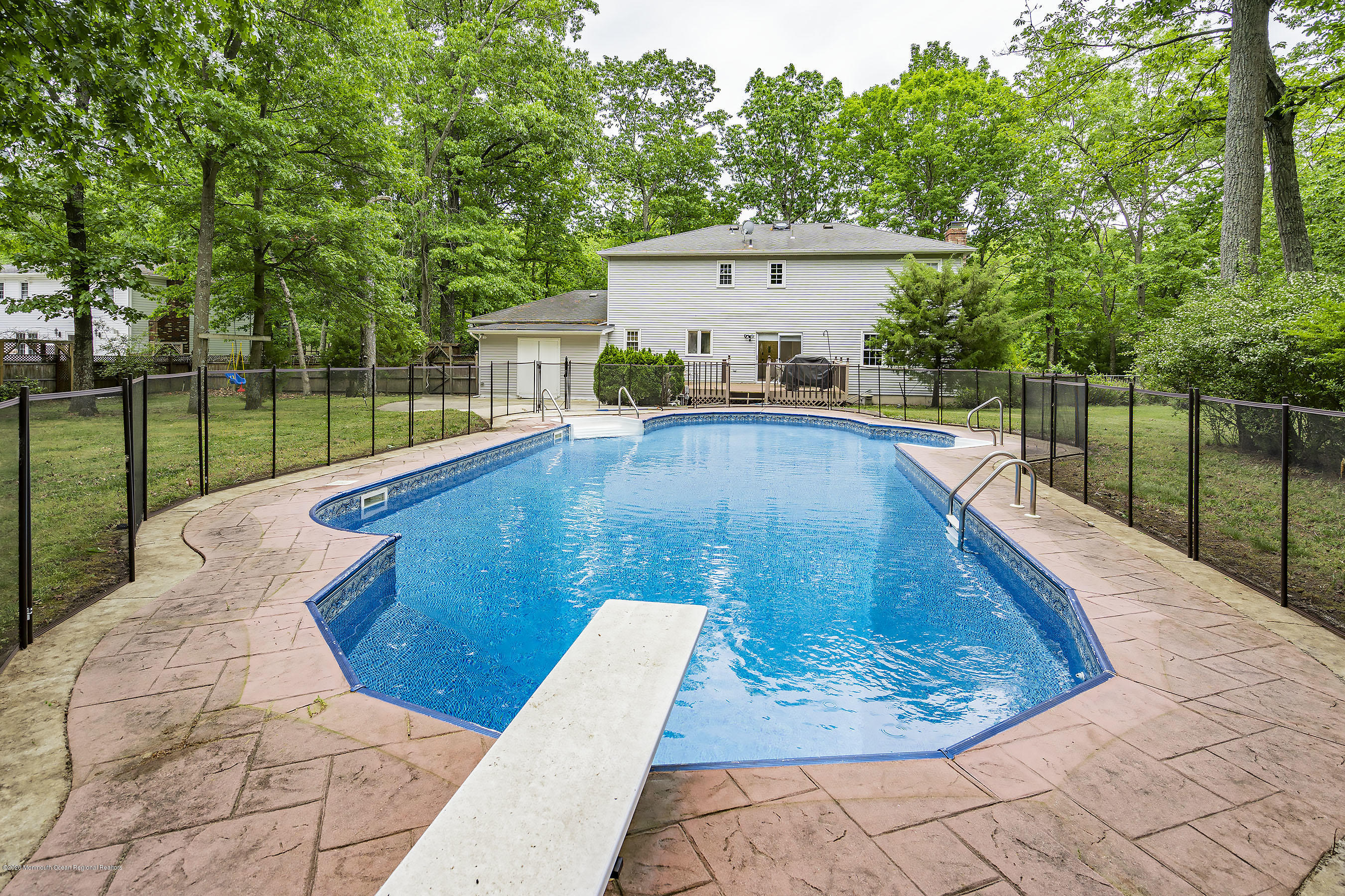 702 Green Valley Road Jackson, NJ 08527 - Photo 30 of 37 a view of a swimming pool with a patio