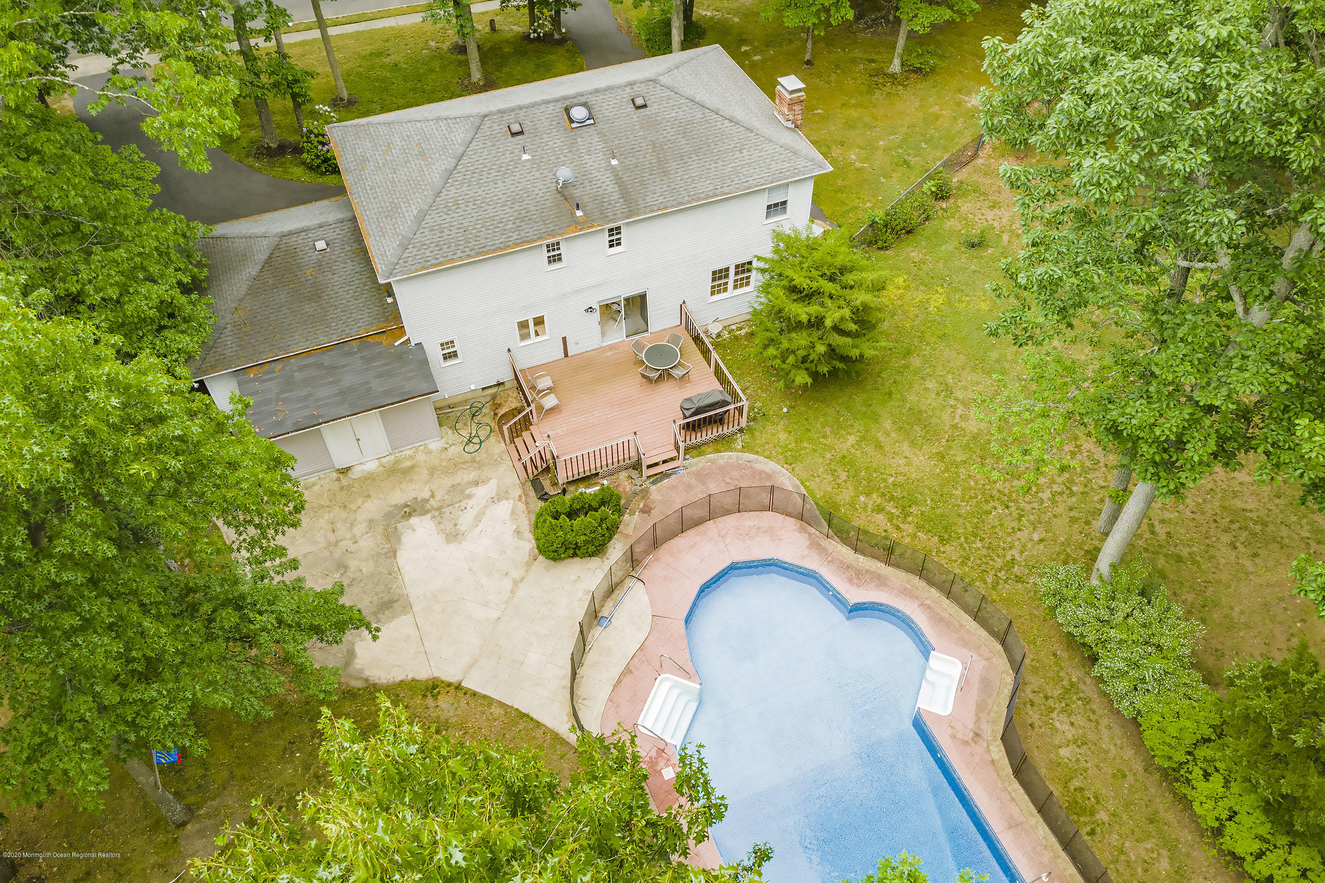 702 Green Valley Road Jackson, NJ 08527 - Photo 31 of 37 an aerial view of a house with a yard and trees all around