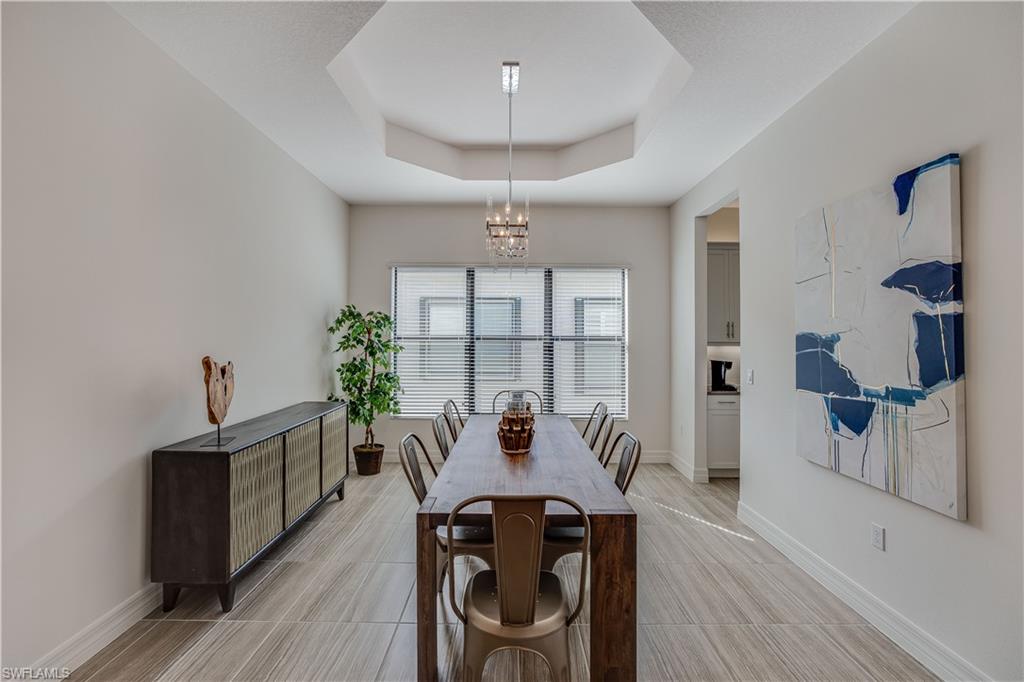 4549 Azalea Drive Naples, FL 34119 - Photo 14 of 25 a view of a dining room with furniture window and outside view