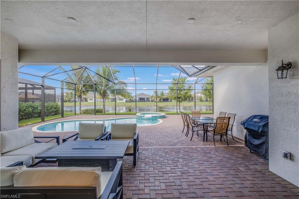 4549 Azalea Drive Naples, FL 34119 - Photo 24 of 25 a view of a dining room with furniture window and outside view
