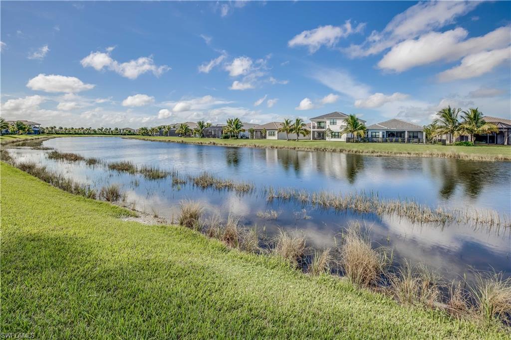 4549 Azalea Drive Naples, FL 34119 - Photo 25 of 25 a view of a lake from a yard