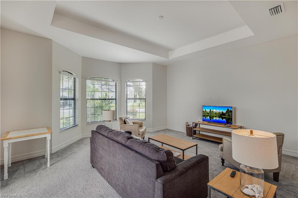 4549 Azalea Drive Naples, FL 34119 - Photo 9 of 25 a living room with furniture and a window