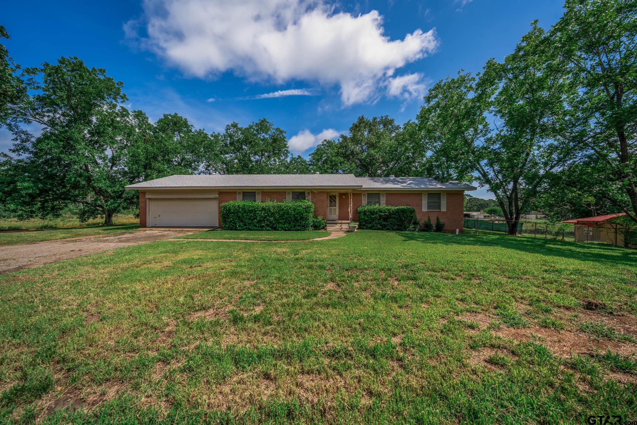 126 Jordan Street Rusk, TX 75785 - Photo 1 of 39 a front view of house with a garden