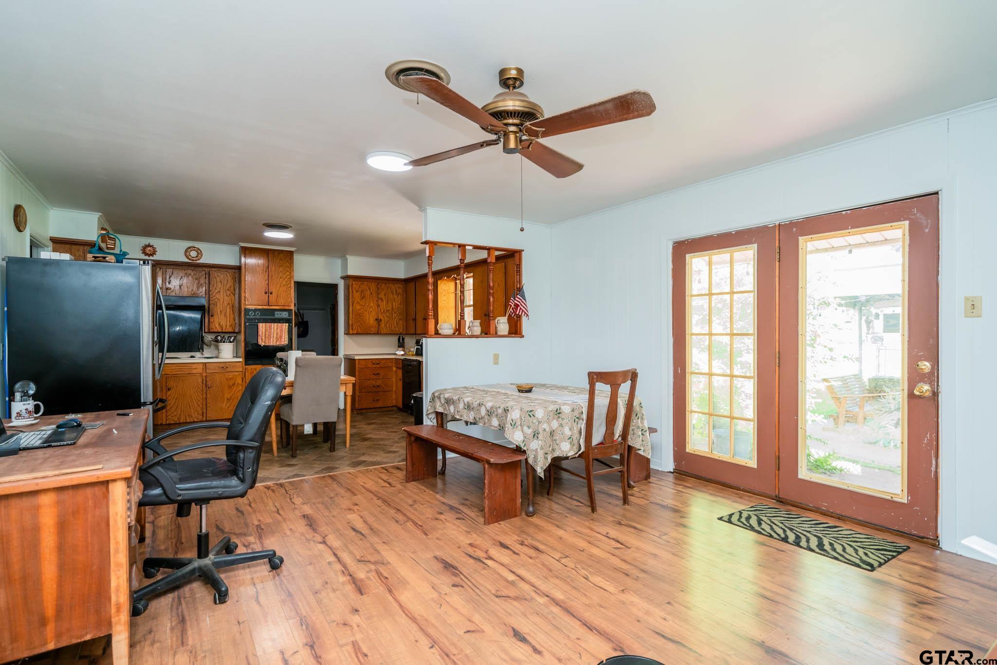 126 Jordan Street Rusk, TX 75785 - Photo 11 of 39 a workspace with wooden floor and furniture