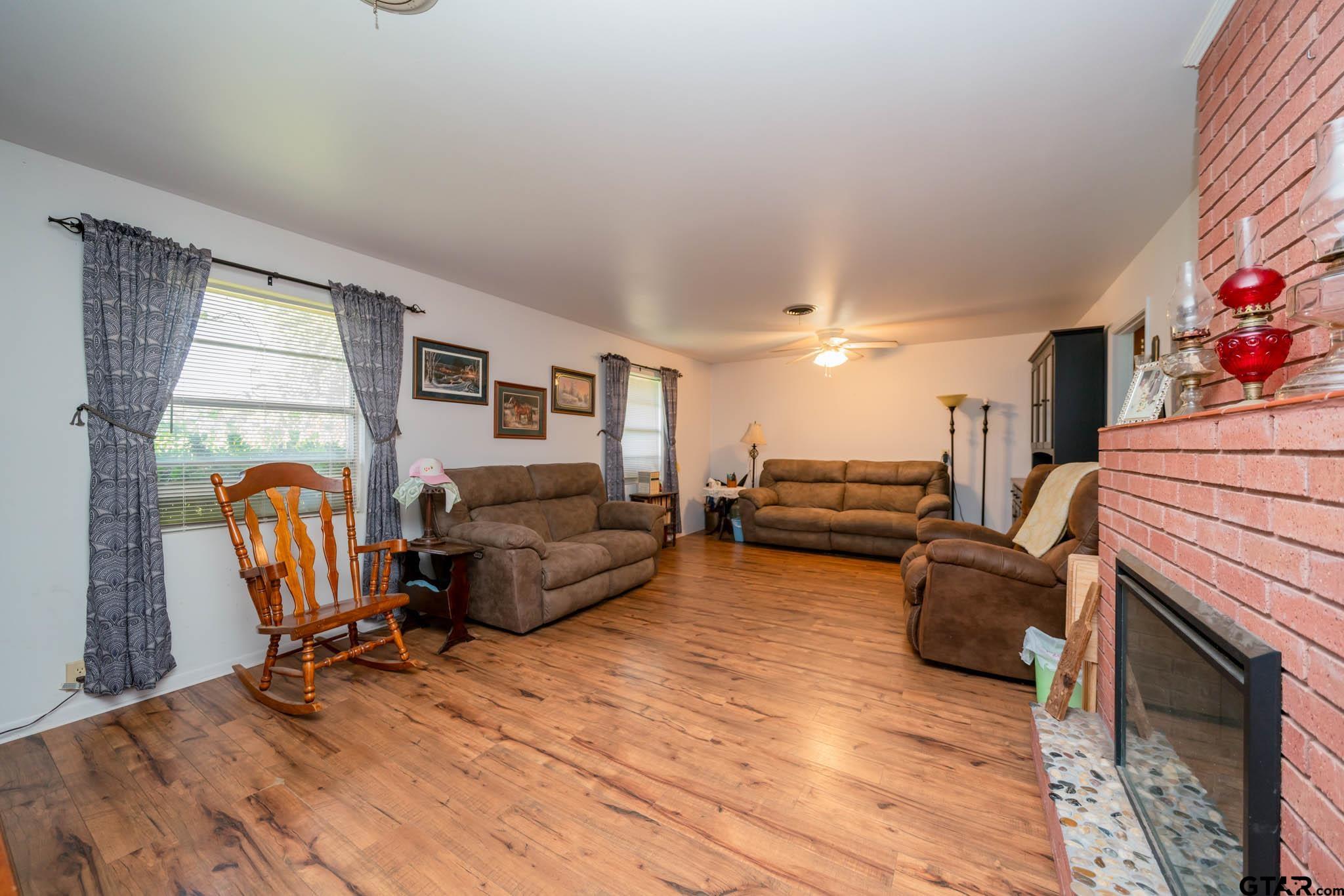 126 Jordan Street Rusk, TX 75785 - Photo 5 of 39 a living room with furniture and a fireplace