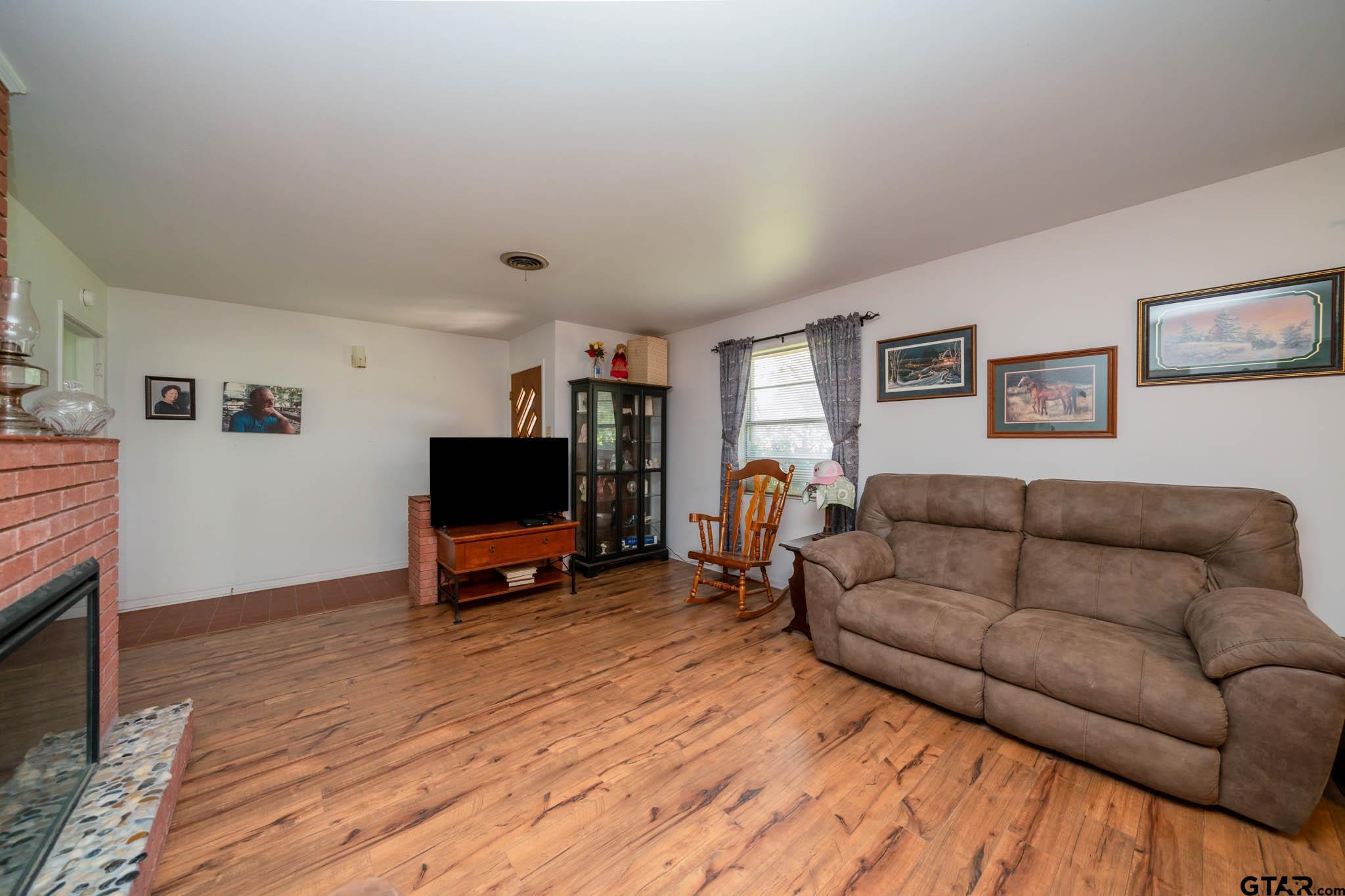 126 Jordan Street Rusk, TX 75785 - Photo 8 of 39 a living room with furniture and a flat screen tv