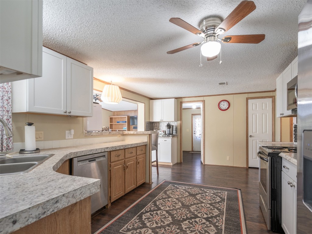 54598 Sheffield Road Callahan, FL 32011 - Photo 12 of 36 a kitchen with a sink appliances and cabinets