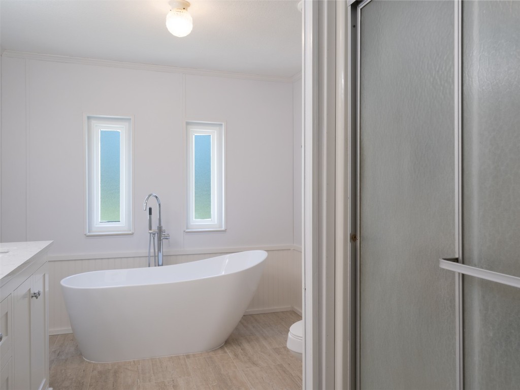 54598 Sheffield Road Callahan, FL 32011 - Photo 20 of 36 a white bath tub sitting in a bathroom