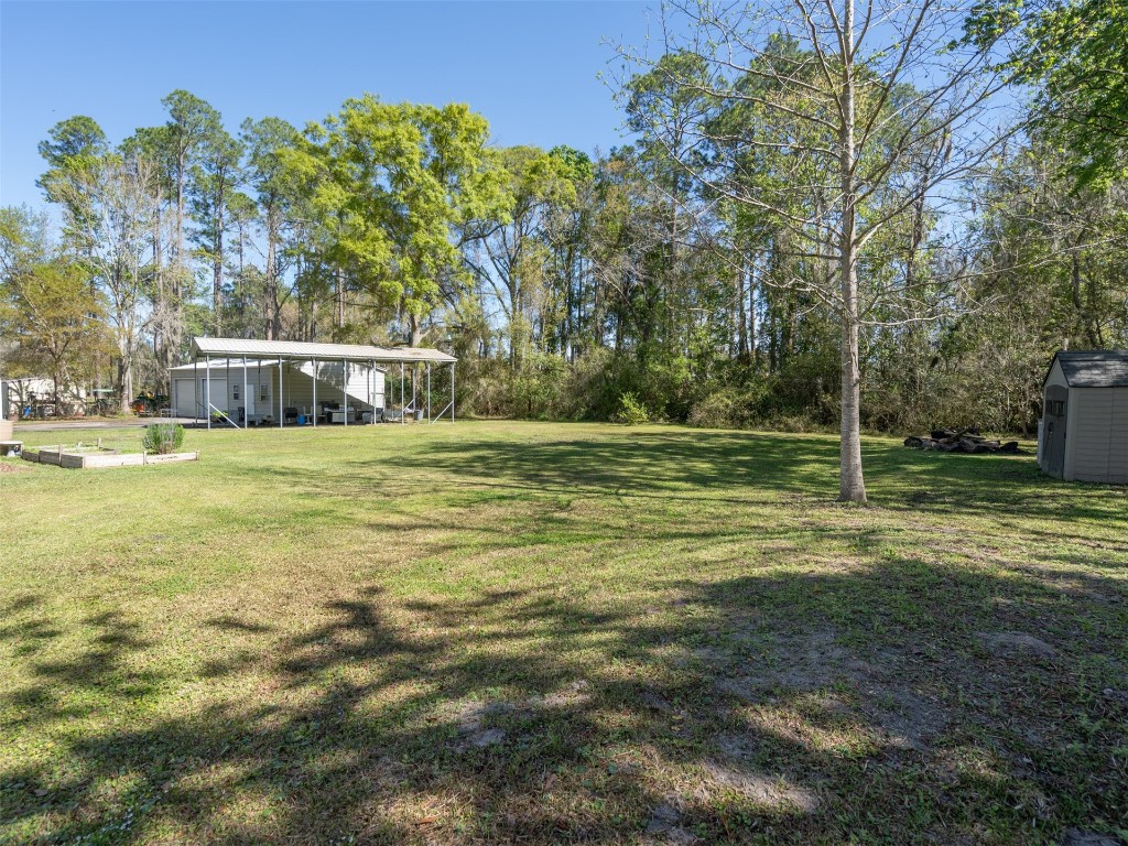 54598 Sheffield Road Callahan, FL 32011 - Photo 27 of 36 a view of a house with a big yard