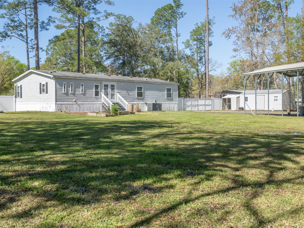 54598 Sheffield Road Callahan, FL 32011 - Photo 29 of 36 a house view with a sitting space and garden