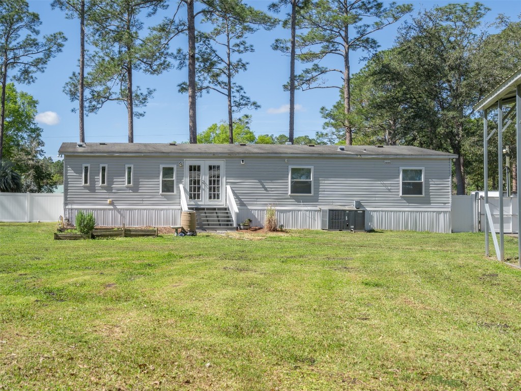 54598 Sheffield Road Callahan, FL 32011 - Photo 30 of 36 front view of a house with a big yard