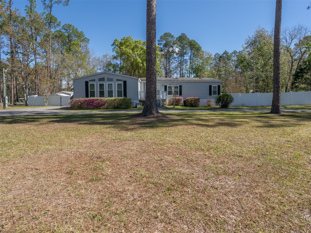 54598 Sheffield Road Callahan, FL 32011 - Photo 3 of 36 a view of a house with a yard