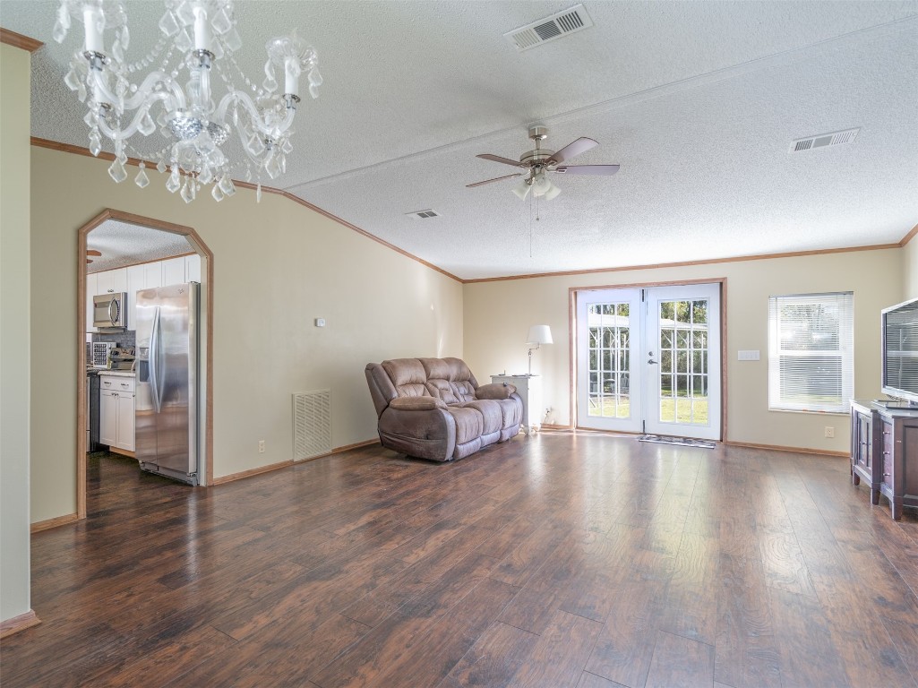 54598 Sheffield Road Callahan, FL 32011 - Photo 10 of 36 a living room with furniture and a chandelier