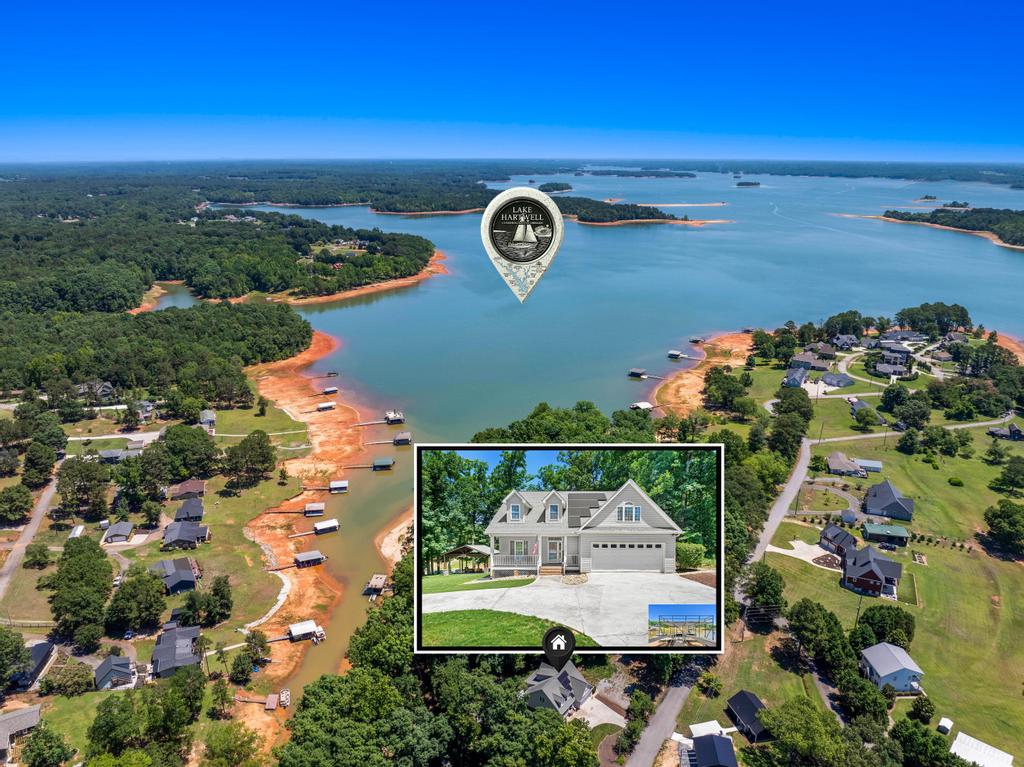 217 Maret Road Townville, SC 29689 - Photo 34 of 35 An aerial perspective showcases numerous lakeside homes with private docks and vibrant blue waters.