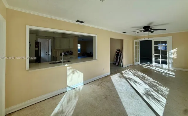 a view of an empty room and window