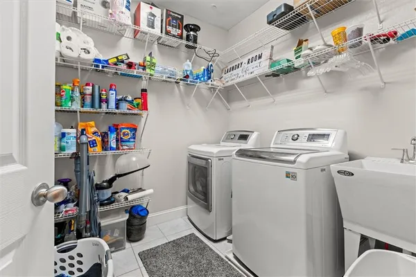 a bathroom with a granite countertop sink double and a mirror