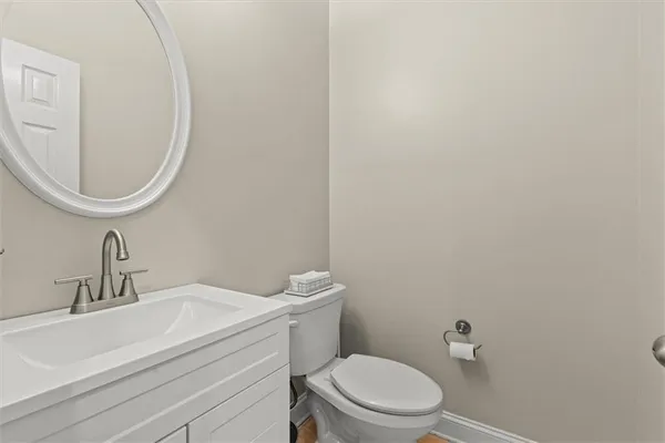 a bath tub sitting in a bathroom next to a window