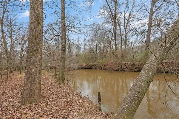 a view of a lake with mountain in the background