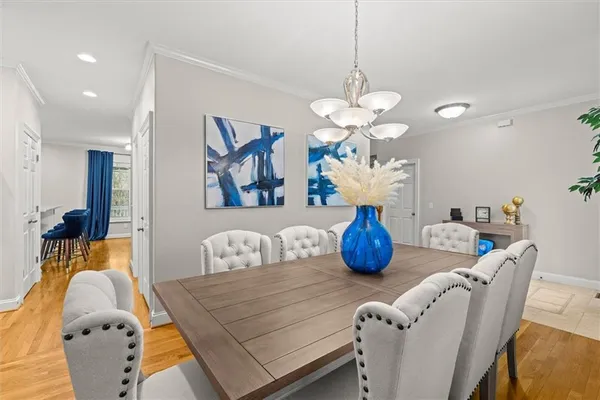 a bedroom with furniture and a chandelier