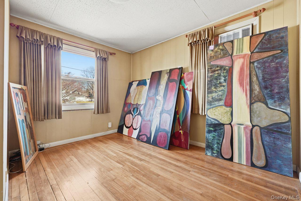 12 Sebago Road Carmel, NY 10512 - Photo 14 of 39 a view of a bedroom with wooden floor and a window