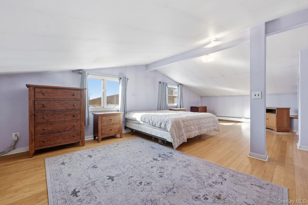 12 Sebago Road Carmel, NY 10512 - Photo 15 of 39 a bedroom with a bed and a dresser