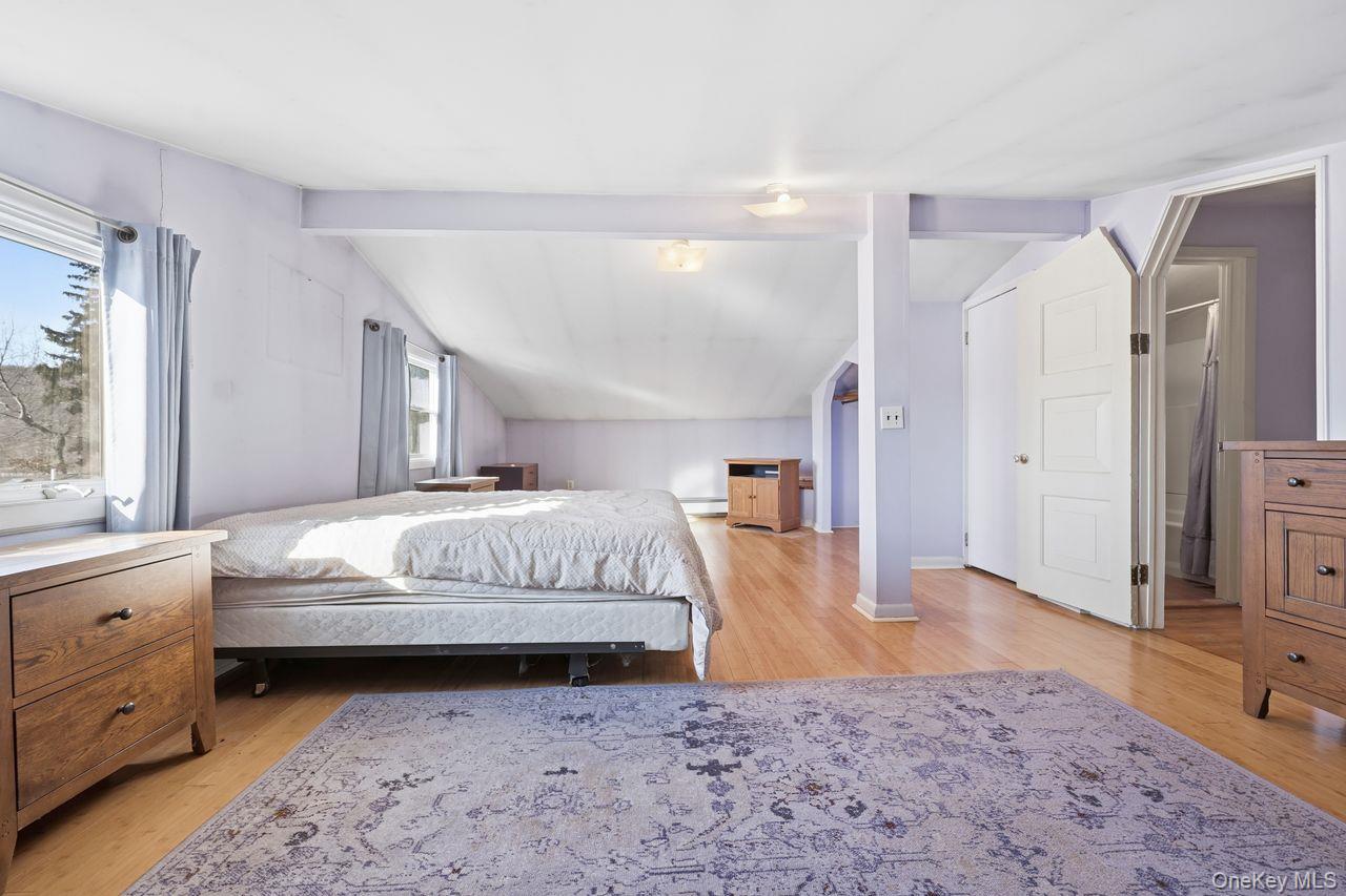 12 Sebago Road Carmel, NY 10512 - Photo 16 of 39 a bed room with a bed and a dresser