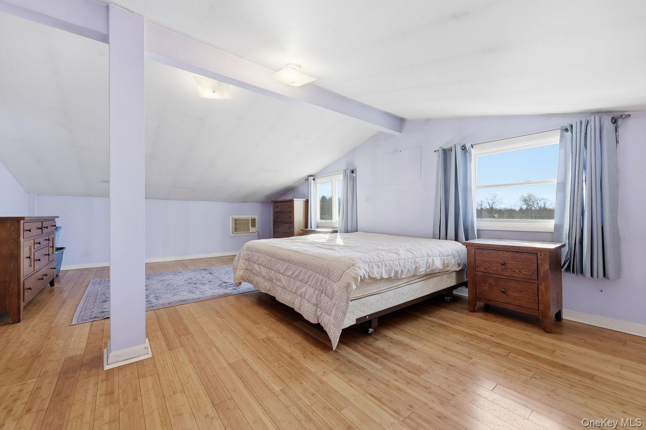 12 Sebago Road Carmel, NY 10512 - Photo 17 of 39 a bedroom with a large bed and a dresser