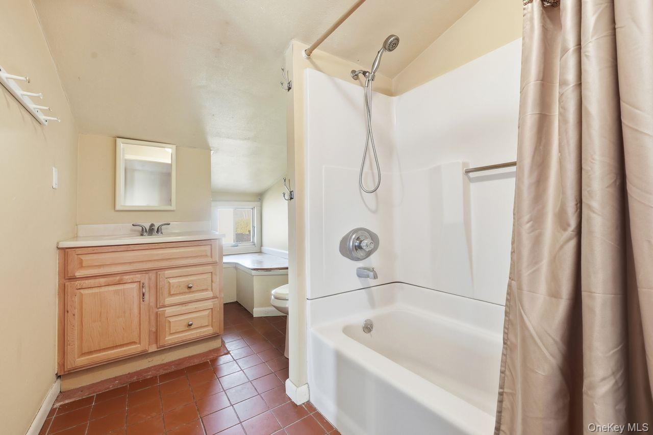 12 Sebago Road Carmel, NY 10512 - Photo 18 of 39 a bathroom with a tub sink toilet and mirror
