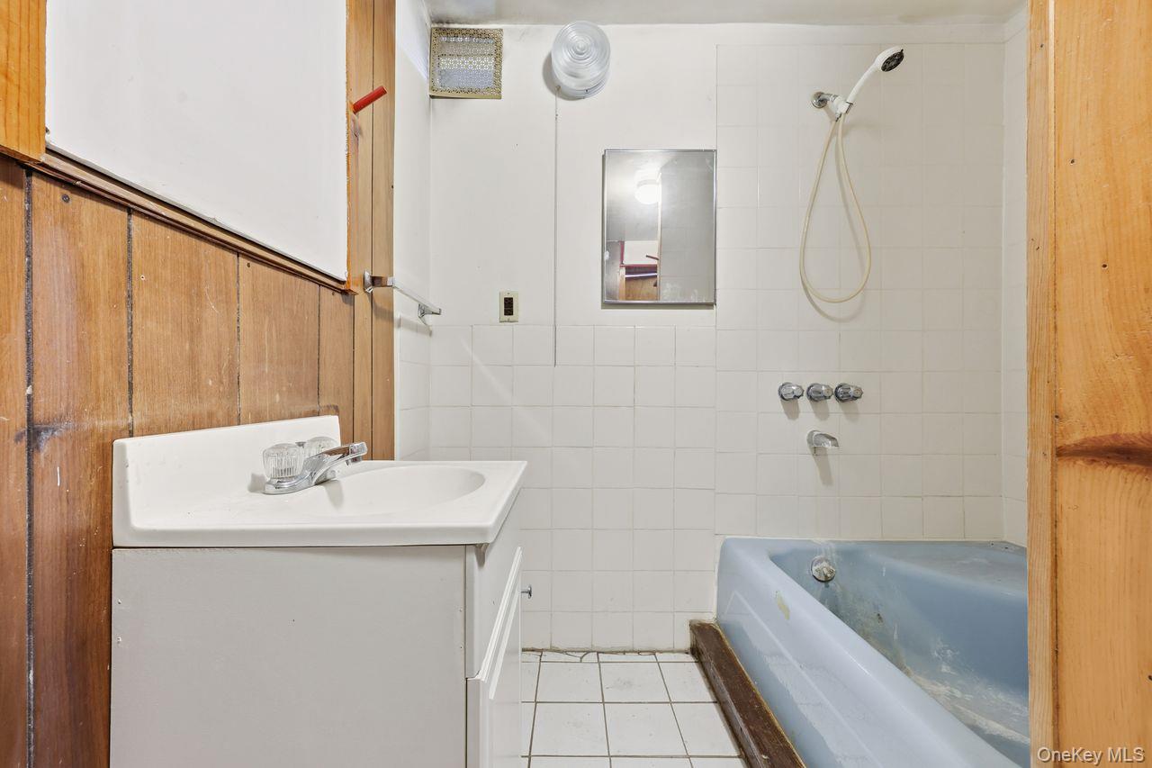 12 Sebago Road Carmel, NY 10512 - Photo 25 of 39 a bathroom with a sink a bath tub and a shower
